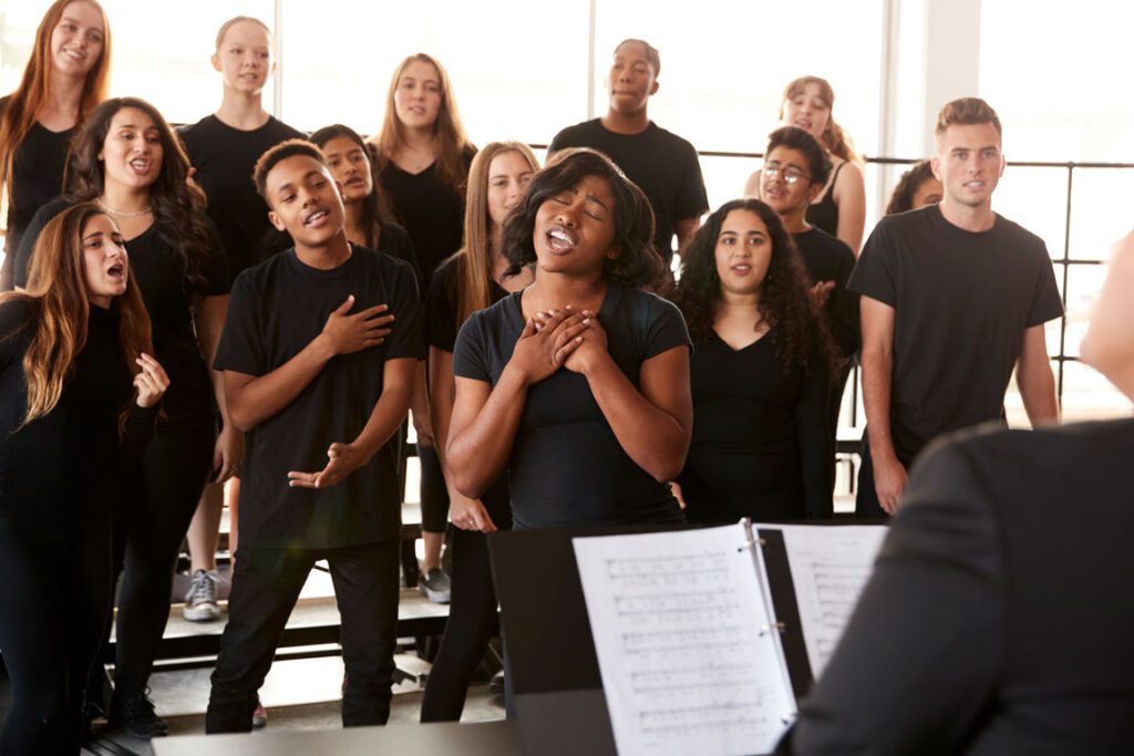 group of teenagers singing in choir